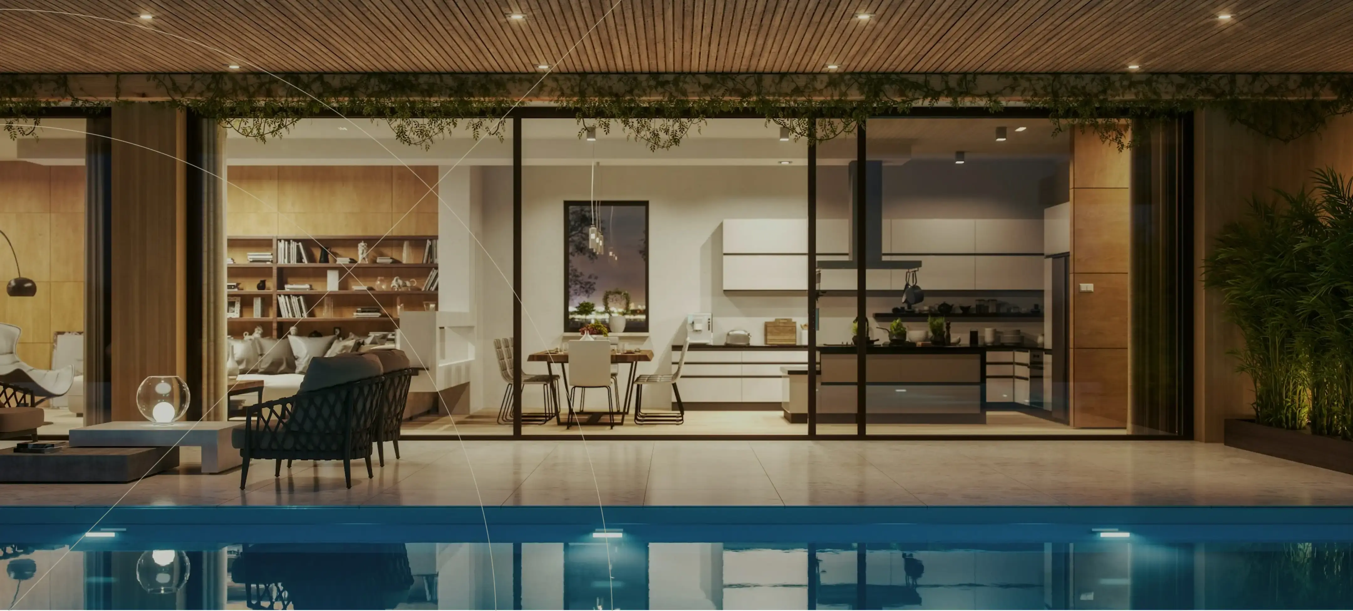 Luxurious modern home with large glass walls opening to a poolside terrace